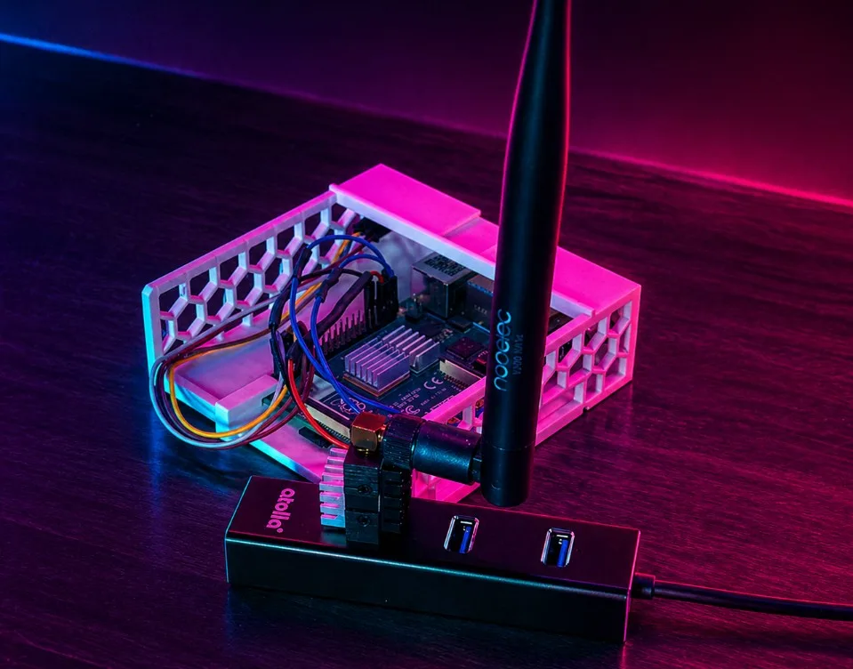 Synthwave-styled render of an antenna and Raspberry Pi over a glowing magenta and cyan grid